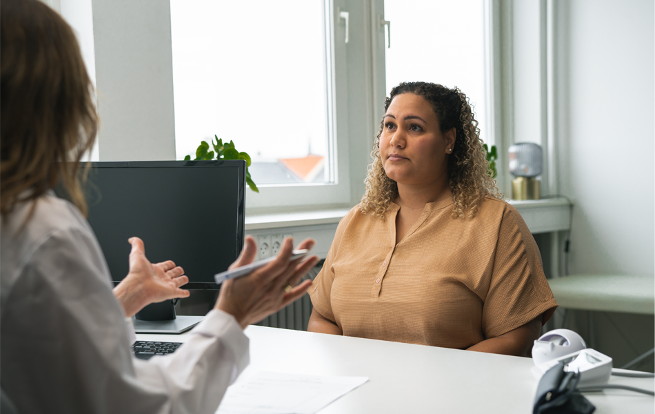 Woman speaking to doctor