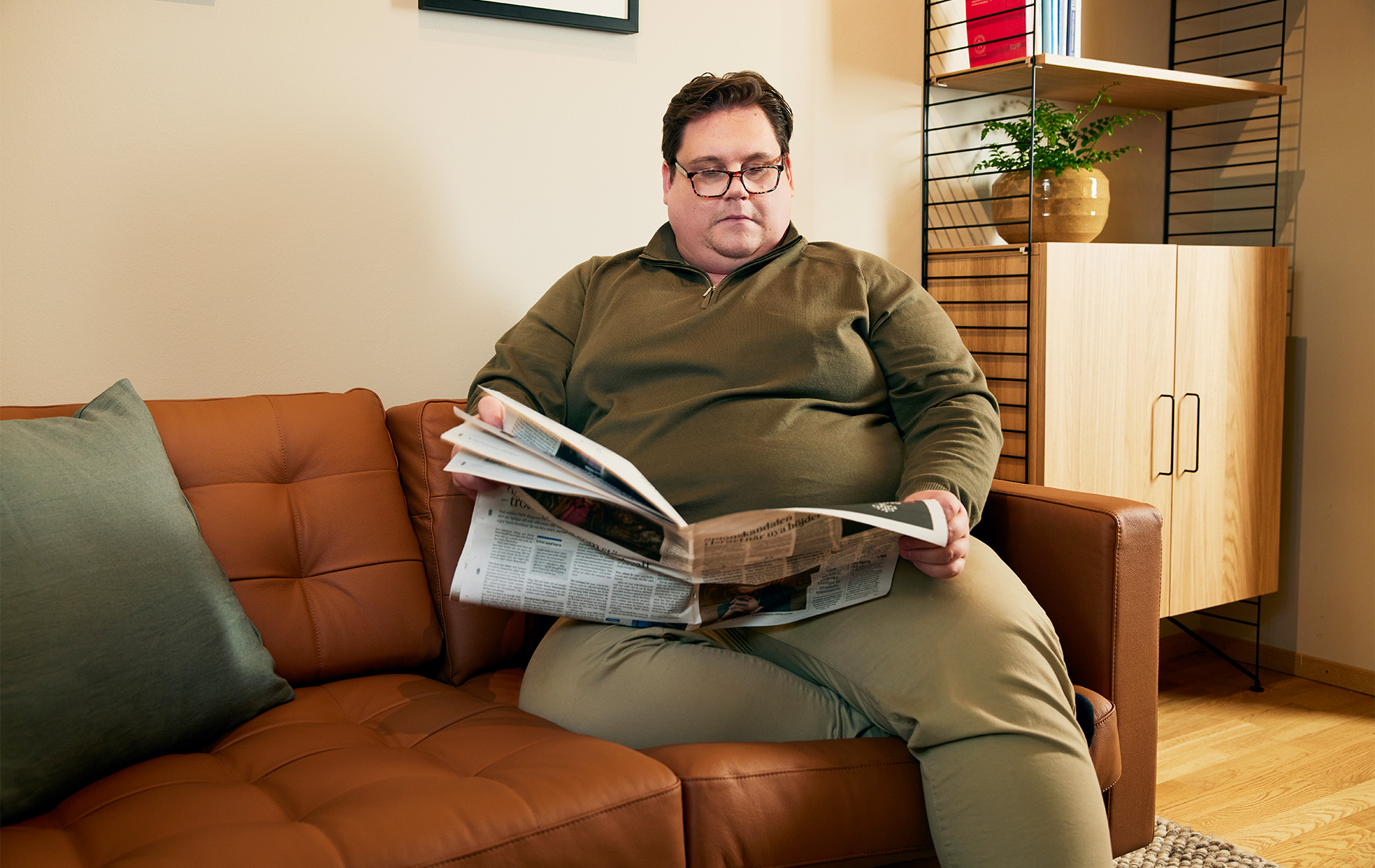 Man sitting and ready the newspaper