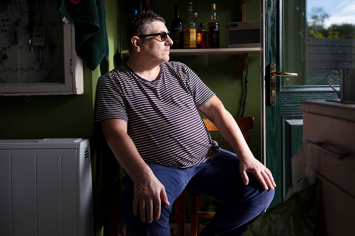 Wynford sitting in front of open door looking out